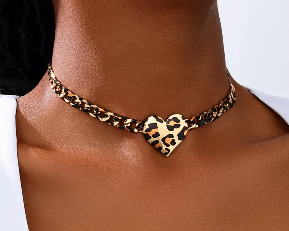 NYLD GLAM by NEWYORKLISTED: model is wearing a leopard print chocker with heart shaped pendant