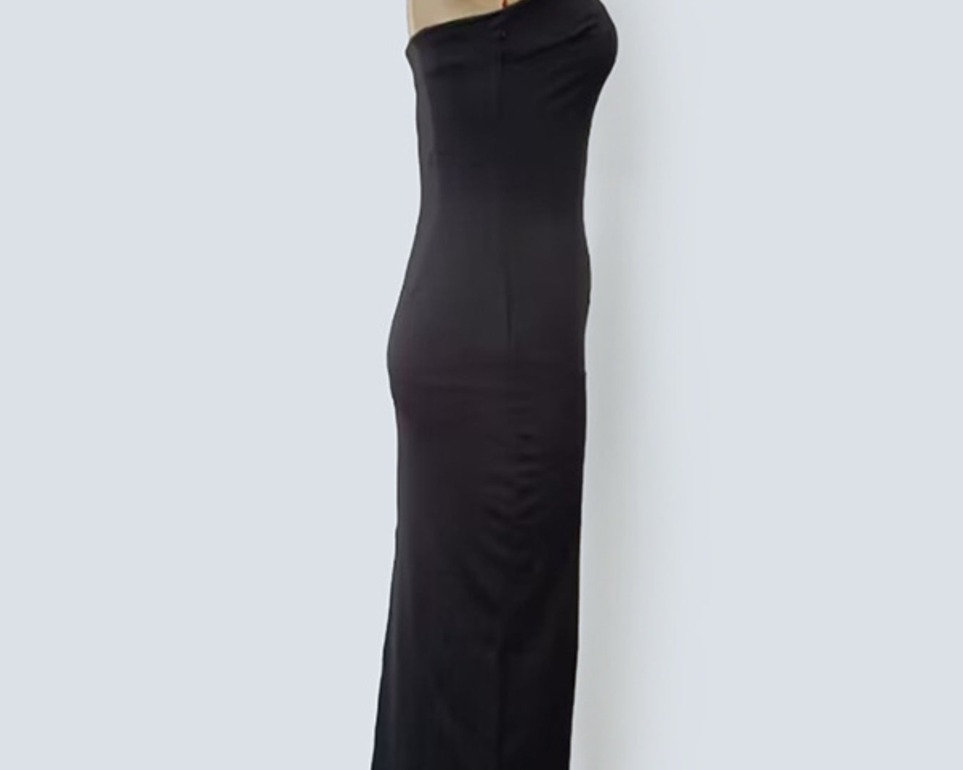 NEWYORKLISTED STYLE COLLECTION: Black dress on a mannequin against a white background