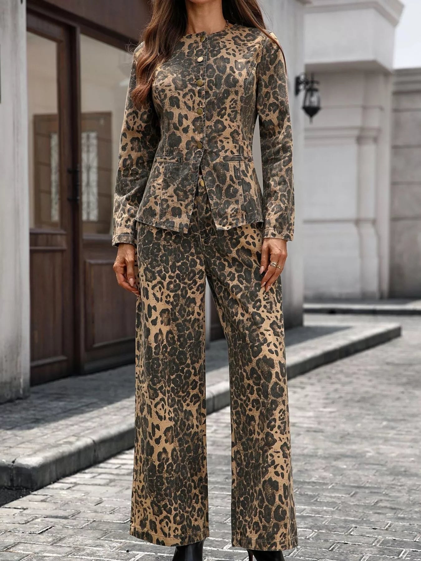 NEWYORKLISTED STYLE COLLECTION: Person wearing a leopard print suit standing on a street.