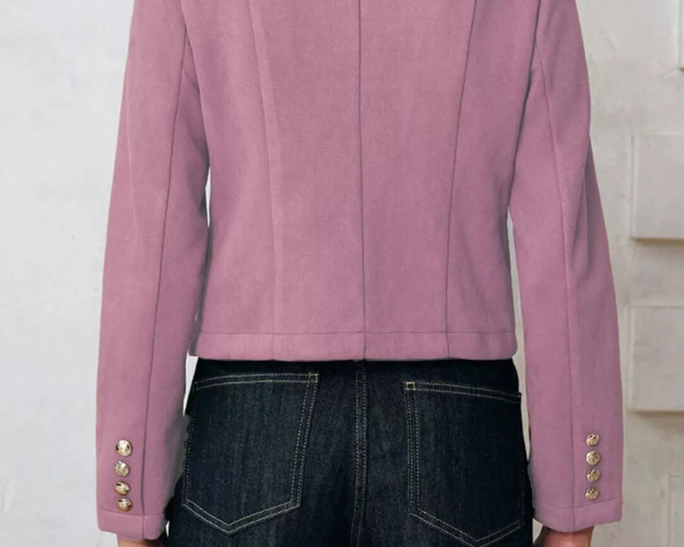NEWYORKLISTED Style Collection Pink blazer with gold buttons worn by a person against a white background