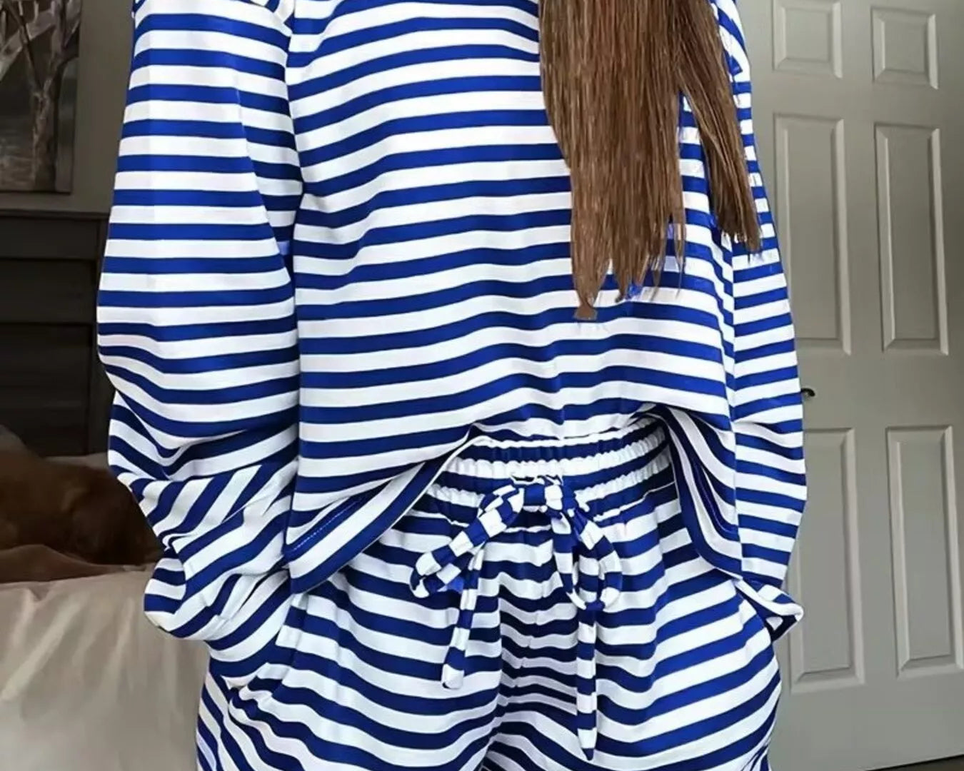 NEWYORKLISTED Comfort Collection: Person wearing a blue and white striped outfit in a room.