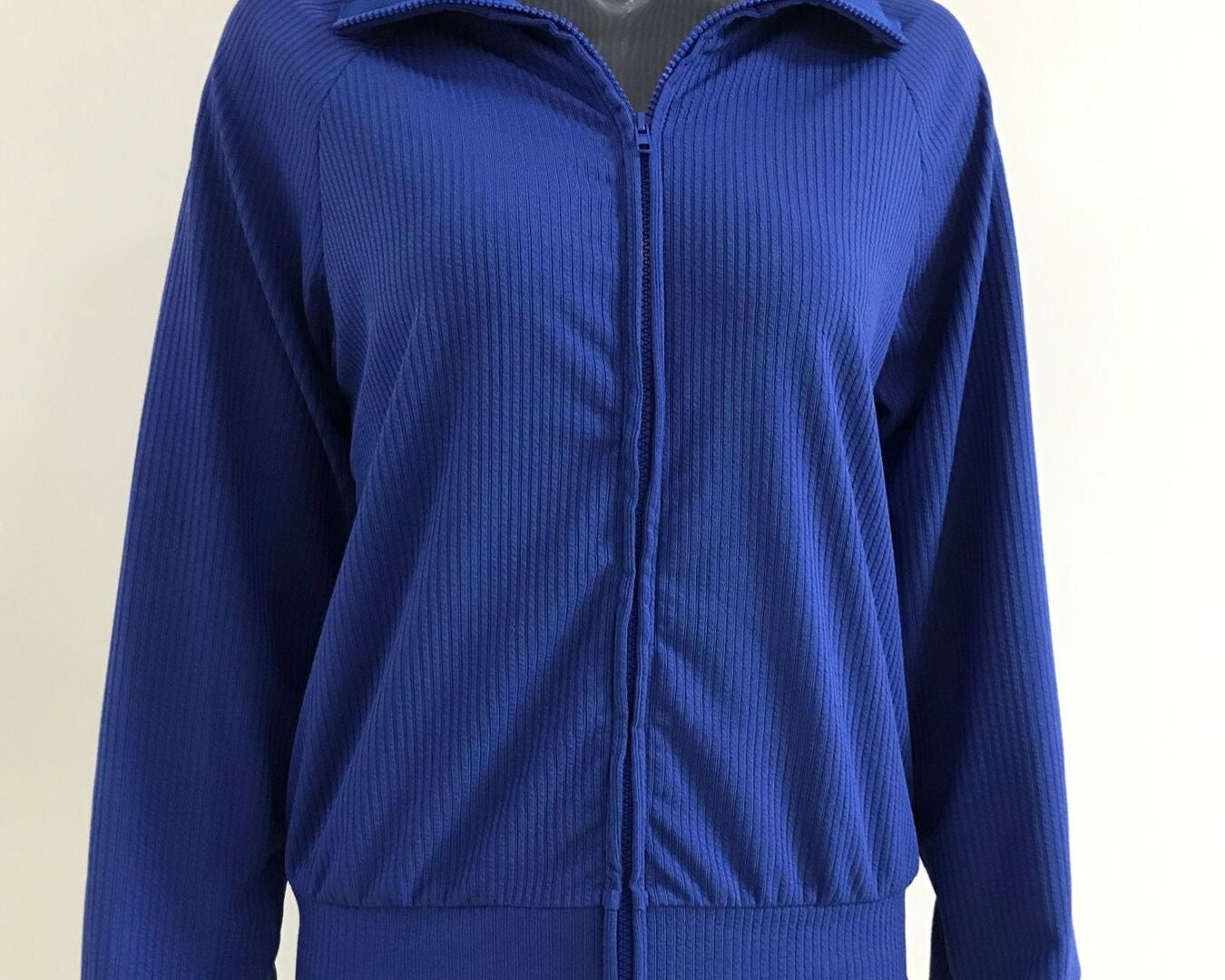 NEWYORKLISTED STYLE COLLECTION: Blue jacket on a mannequin against a white background