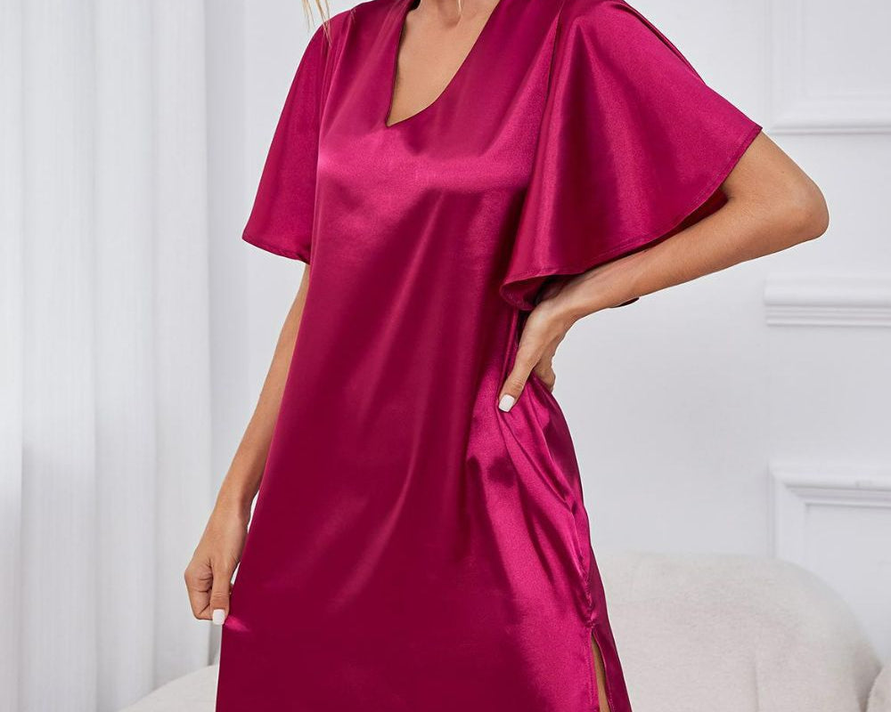 NEWYORKLISTED Intimate Apparel: Woman wearing a pink satin dress in a room with white furniture.