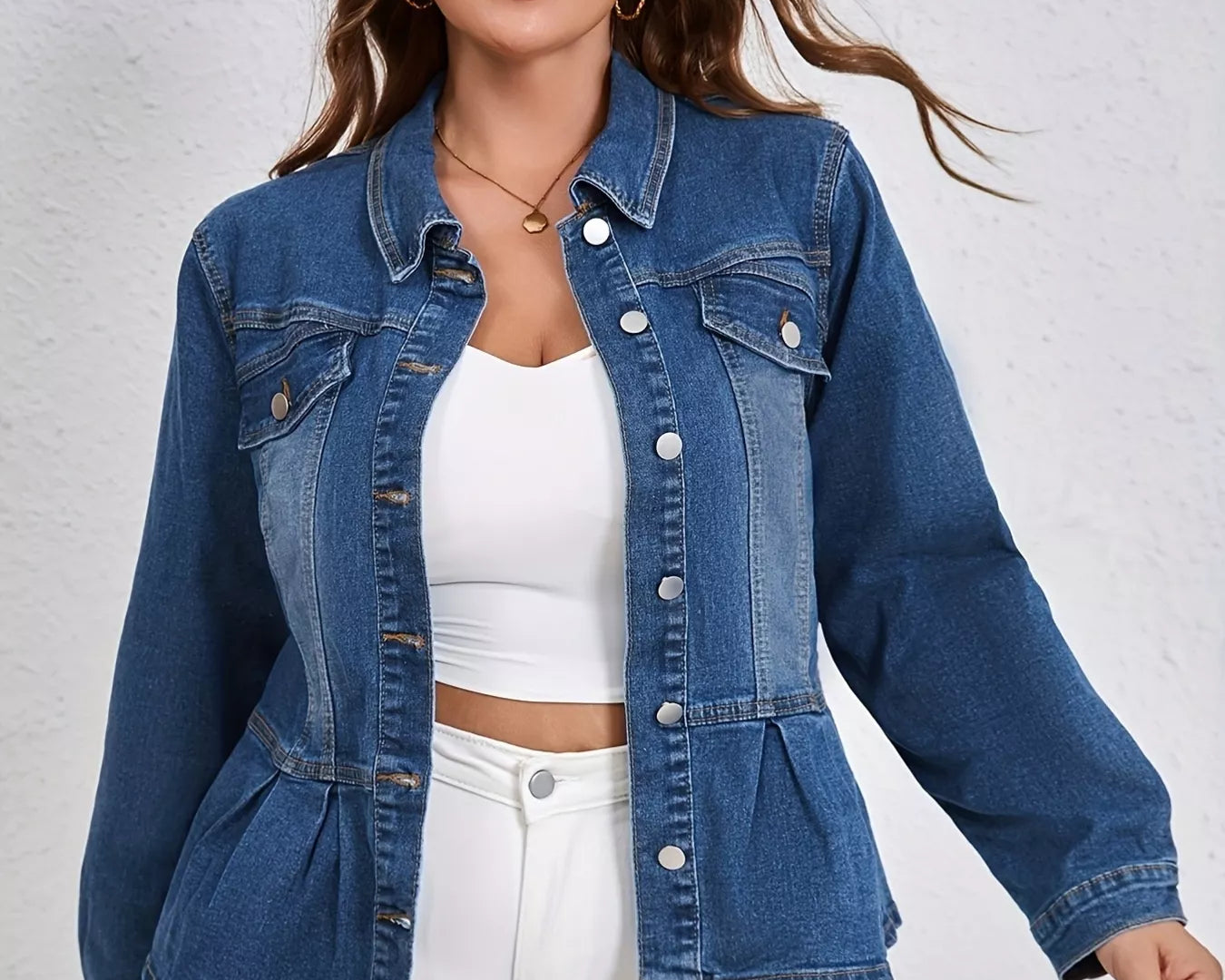 NEWYORKLISTED STYLE COLLECTION: Woman wearing a blue denim jacket over a white top and pants on a light gray background