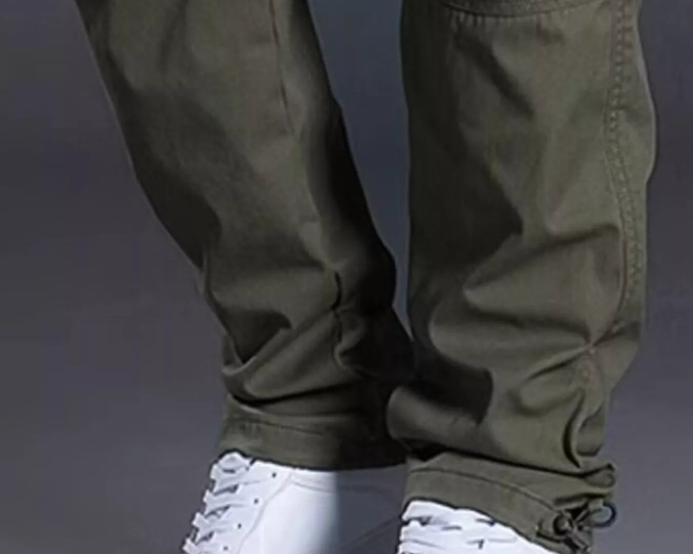 NEWYORKLISTED ATLAS MEN's COLLECTION: Green cargo pants with white sneakers on a gray background