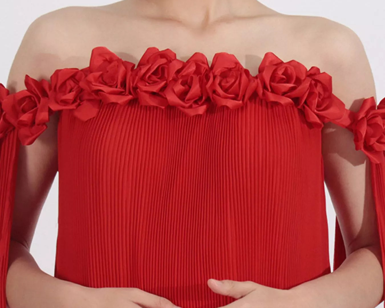 NEWYORKLISTED STYLE COLLECTION: Red off-shoulder dress with floral details on a white background