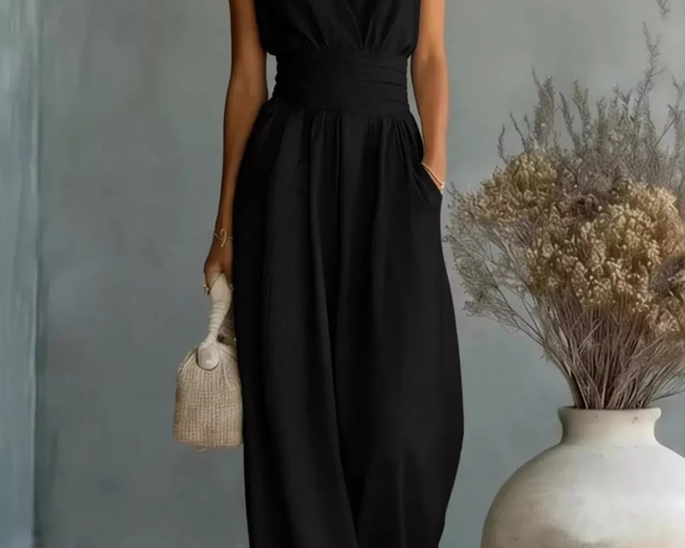 Model wearing the NEWYORKLISTED STYLE COLLECTION sleeveless wide leg jumpsuit with pockets, styled for comfortable everyday boutique fashion.