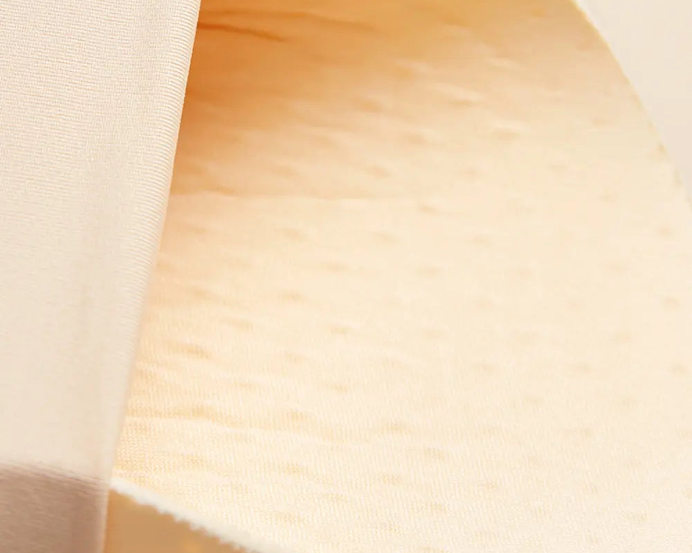 NEWYORKLISTED Intimate Apparel: Close-up of a beige fabric texture