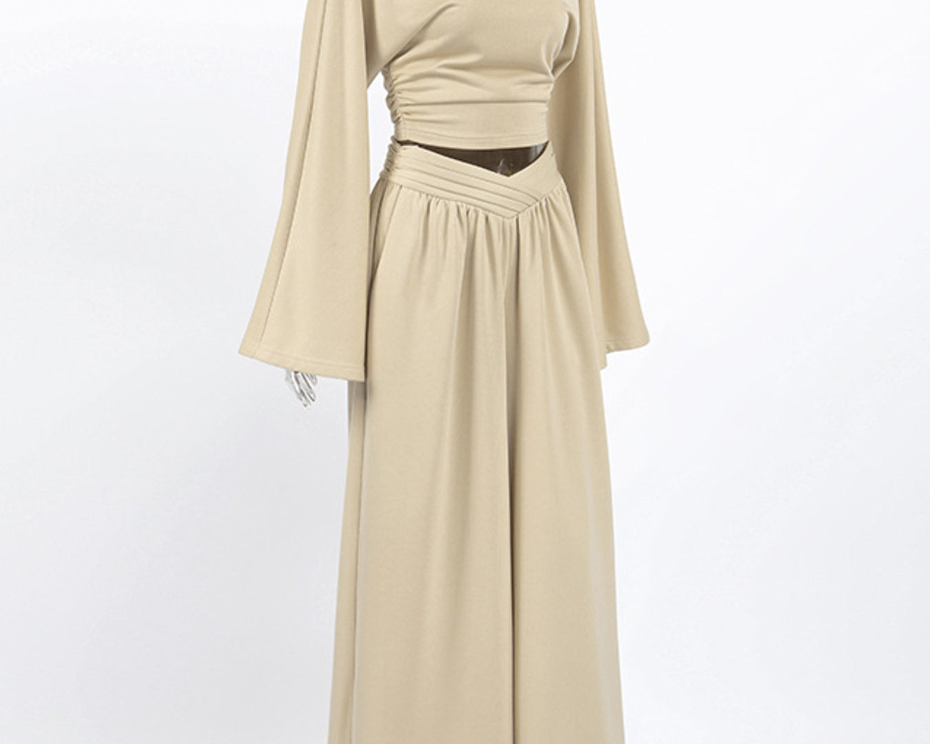 NEWYORKLISTED STYLE COLLECTION: Beige long-sleeve dress on a mannequin against a white background