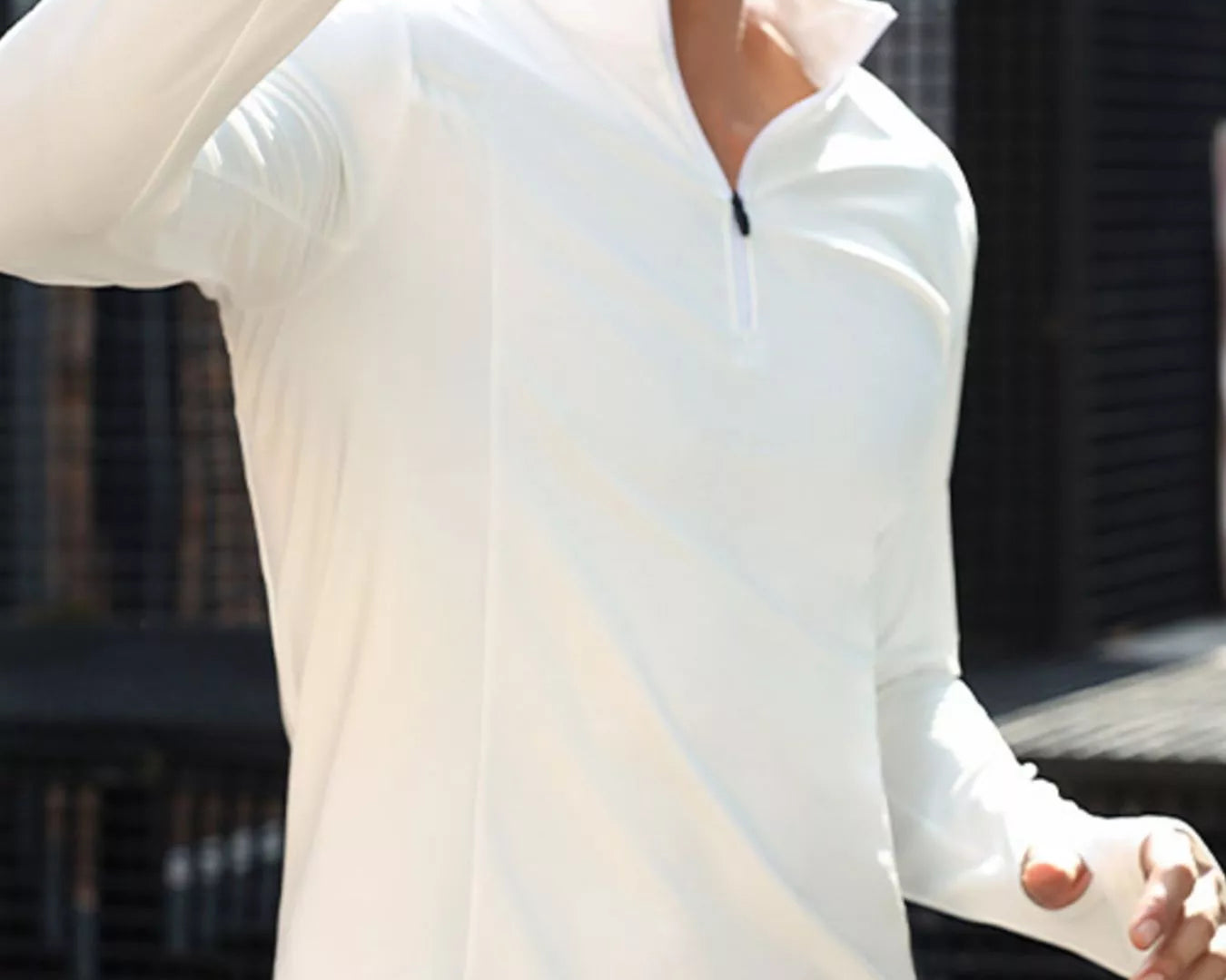 NEWYORKLISTED ATLAS MEN'S COLLECTION: Person wearing a white long-sleeve shirt with a blurred background