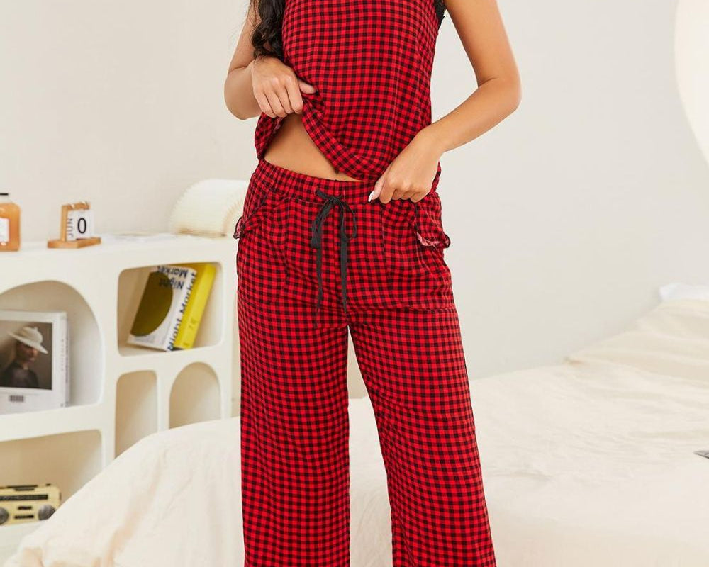 NEWYORKLISTED Intimate Apparel: Woman wearing a red plaid pajama set in a bedroom.