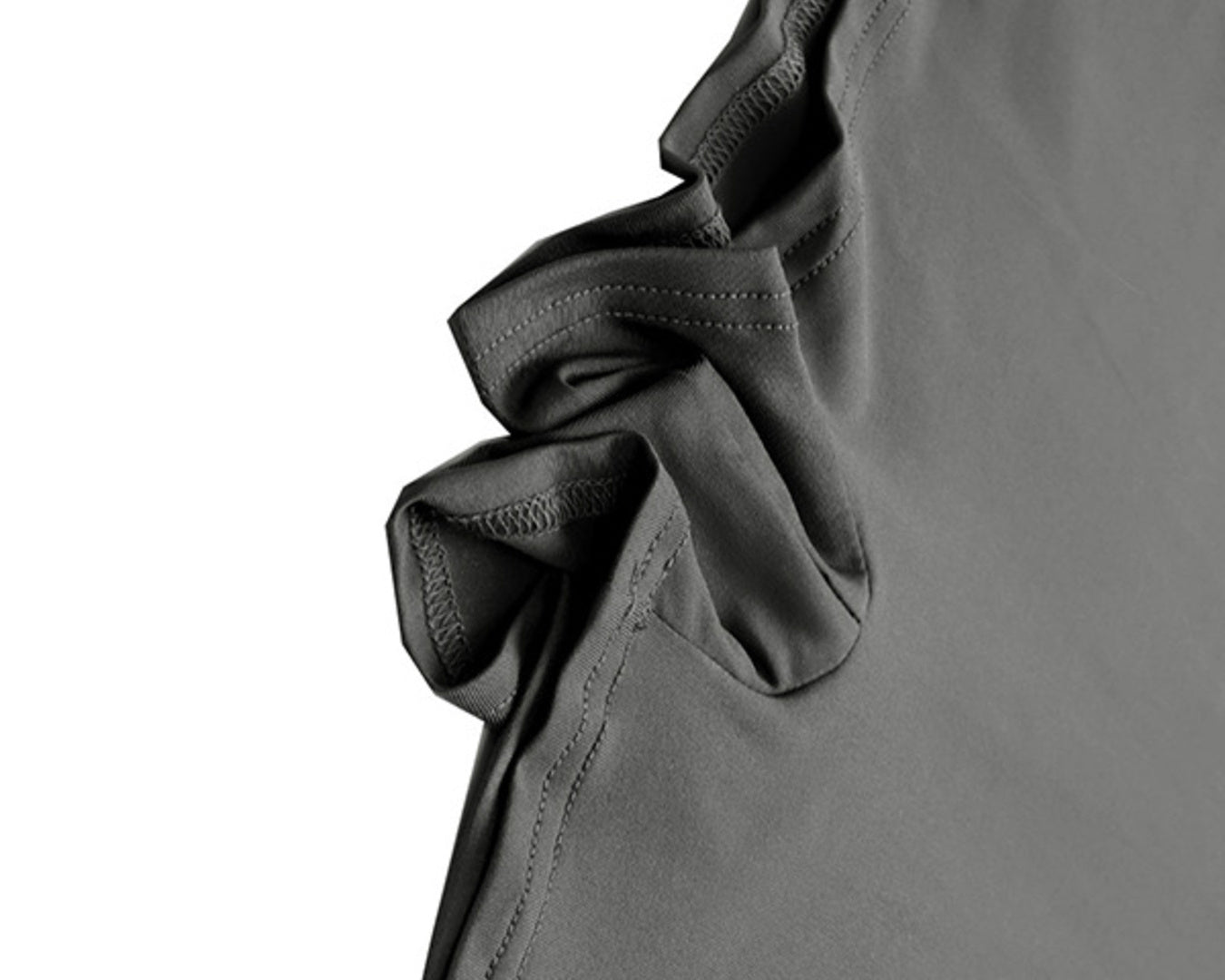 Close-up of a gray garment with a ruffled detail on a white background