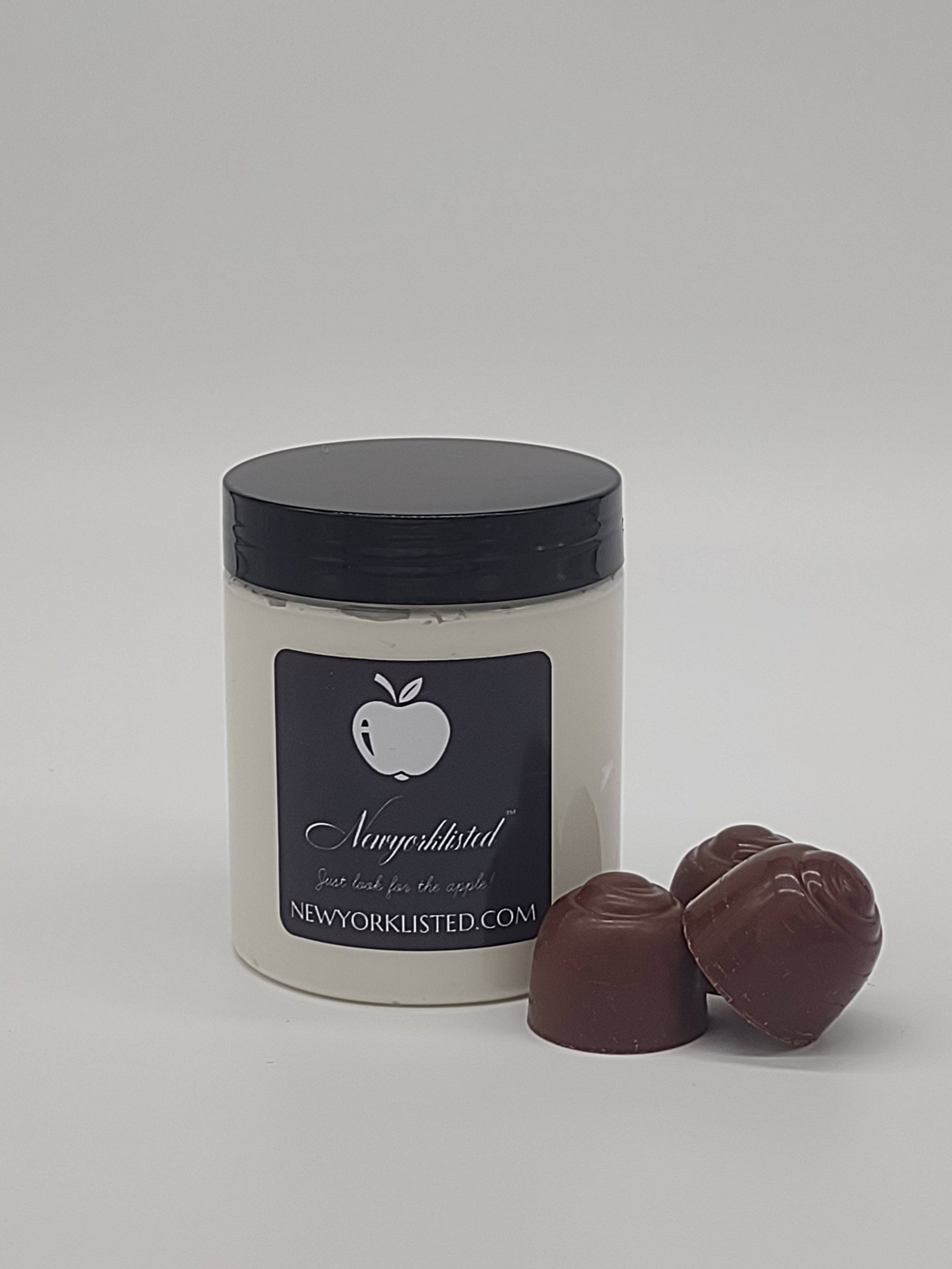 NEWYOPKLISTED Whipped Cocoa Dreams Body Butter shown in 6 oz jar with chocolates.