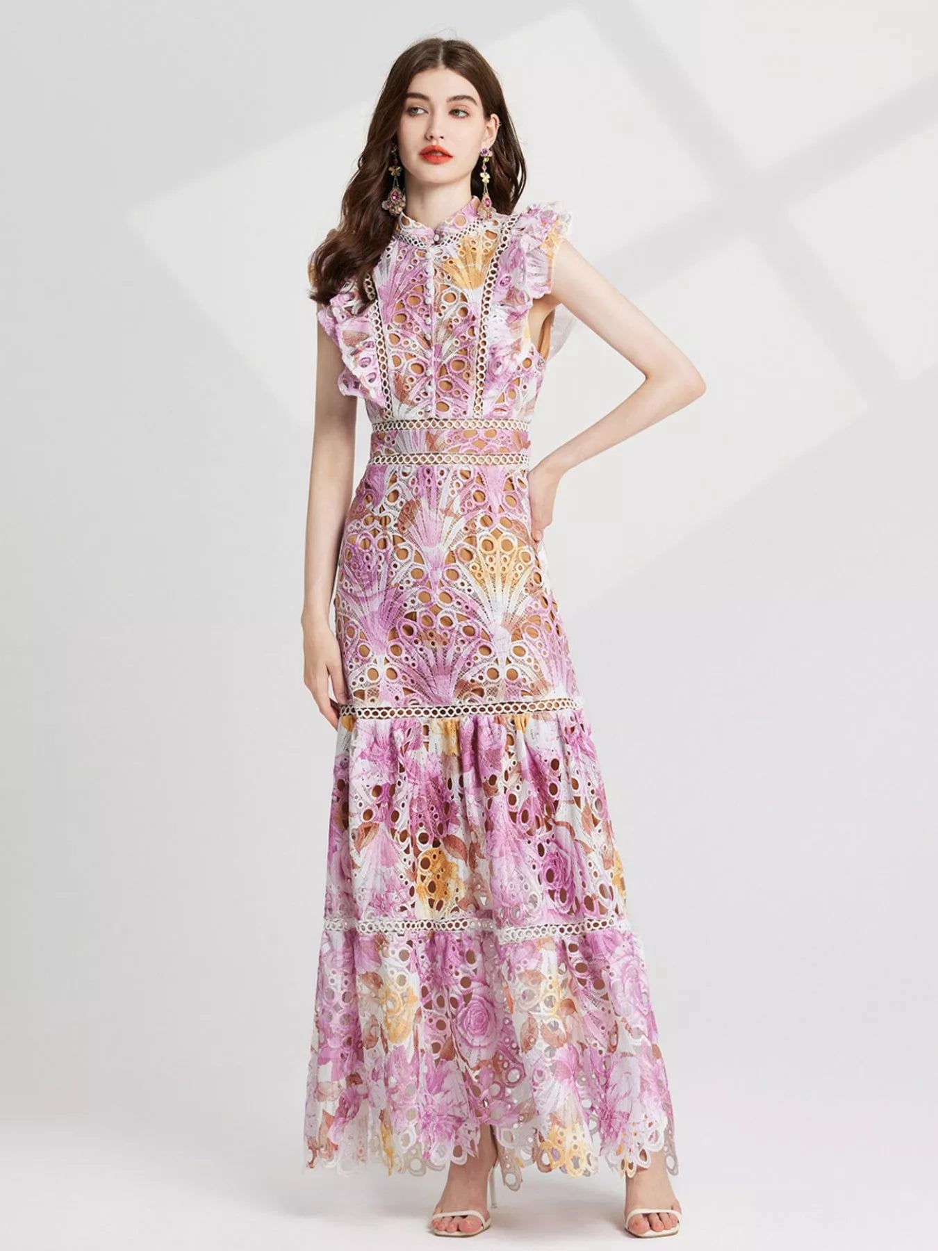 NEWYORKLISTED STYLE COLLECTION: Woman wearing a floral dress on a white background