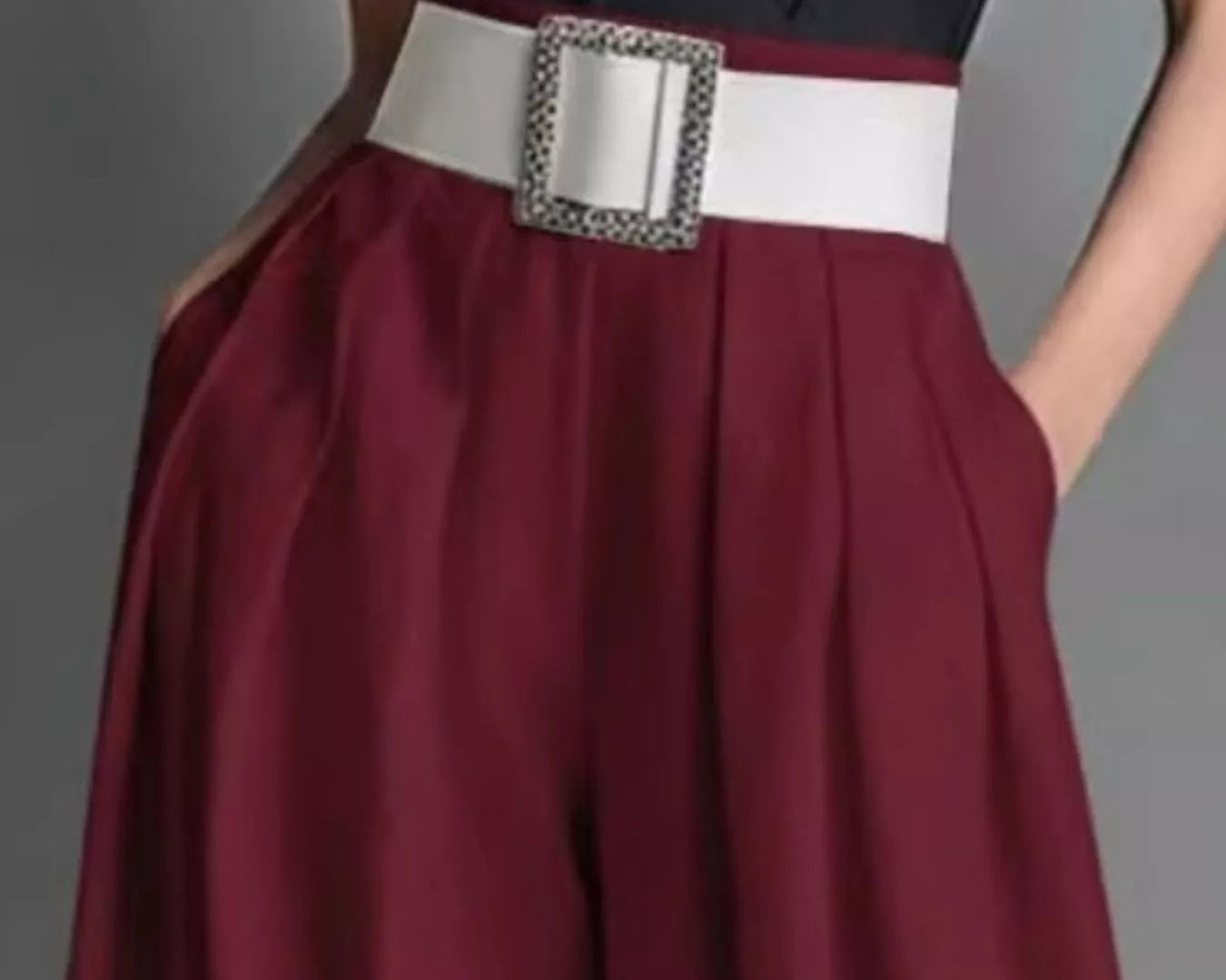NEWYORKLISTED STYLE COLLECTION: Maroon skirt with a white belt and decorative buckle on a gray background