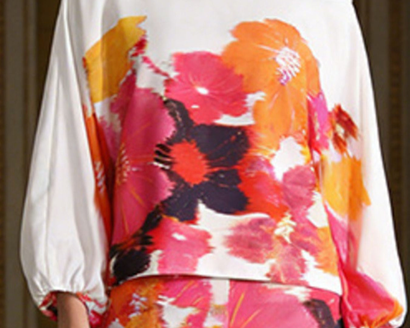 NEWYORKLSITED STYLE COLLECTION: Floral off-shoulder top with colorful design on a plain background