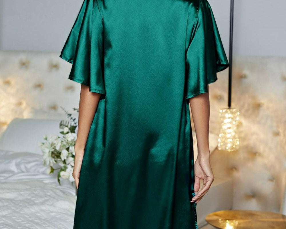 NEWYORKLISTED Intimate Apparel: Woman wearing a green satin robe in a bedroom setting