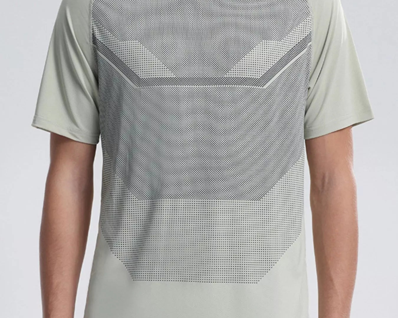 NEWYORKLISTED ATLAS MEN'S COLLECTION: Person wearing a light green athletic shirt with geometric pattern on a plain background