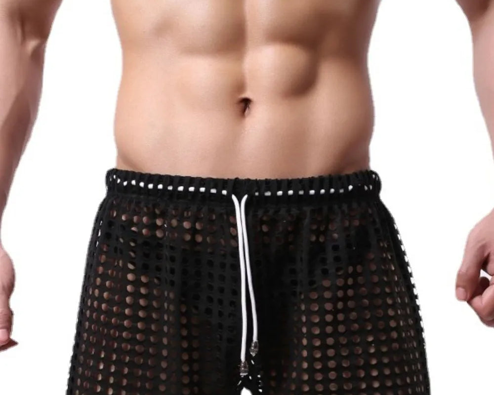 NEWYORKLISTED ATLAS MEN'S COLLECTION: Black mesh swim shorts worn by a person on a white background