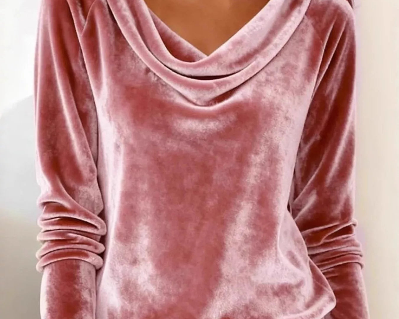 NEWYORKLISTED STYLE COLLECTION: Pink velvet long-sleeve top worn by a person with a neutral background