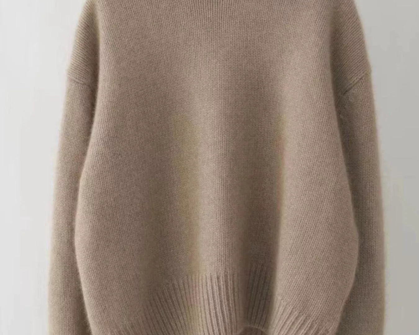 NEWYORKLISTED STYLE COLLECTION: Beige sweater on a white background