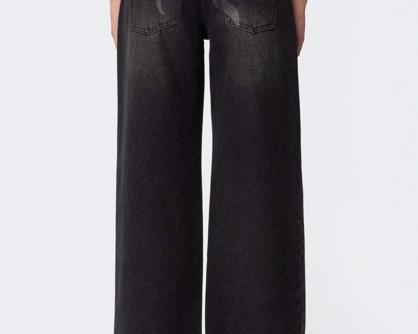NEWYORKLISTED STYLE COLLECTION: Black wide-leg jeans on a white background