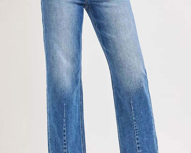 NEWYORKLISTED DENIM COLLECTION: Blue jeans worn by a person on a white background