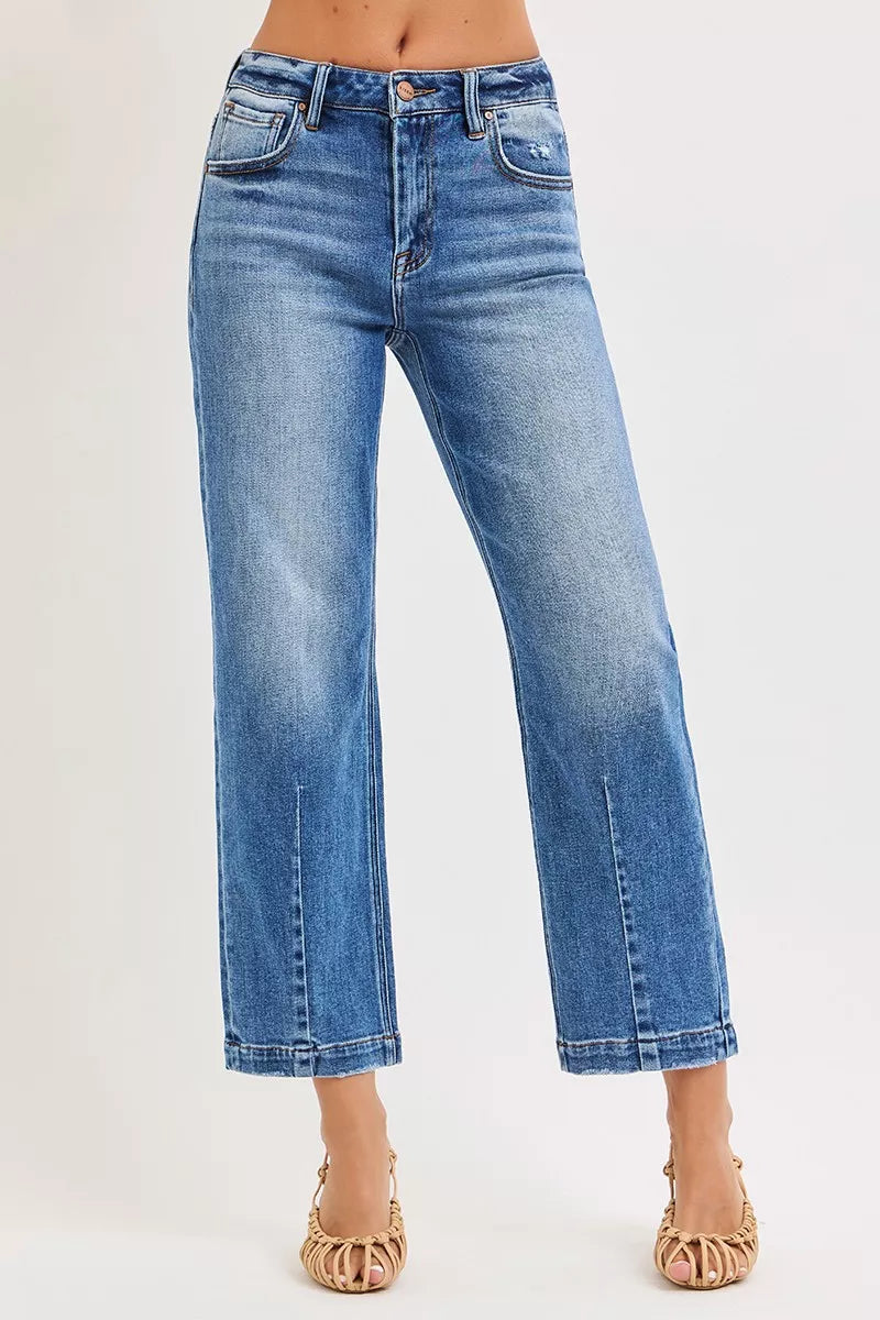 NEWYORKLISTED DENIM COLLECTION: Blue jeans worn by a person on a white background