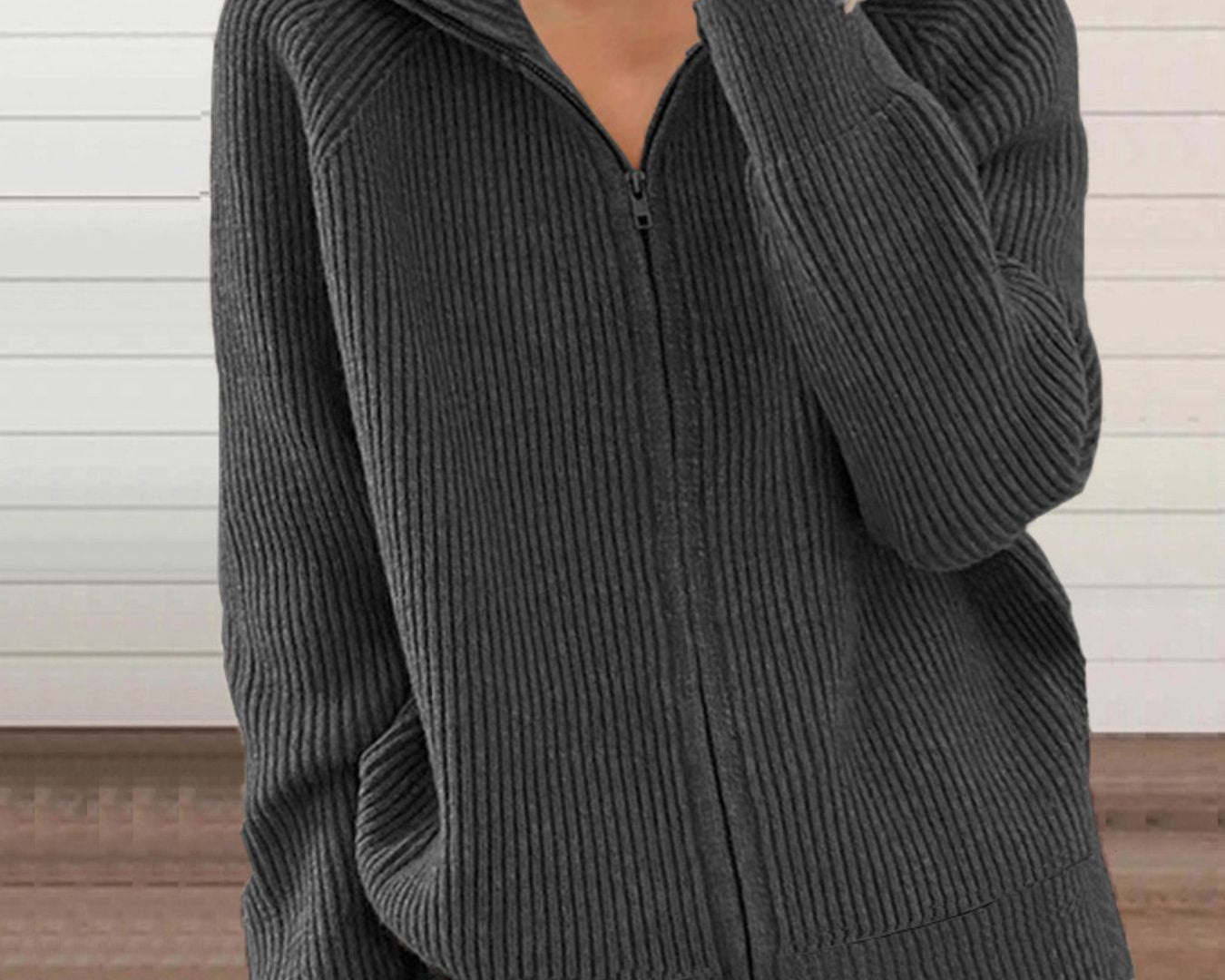 NEWYORKLISTED STYLE COLLECTION: Person wearing a gray ribbed zip-up hoodie against a neutral background