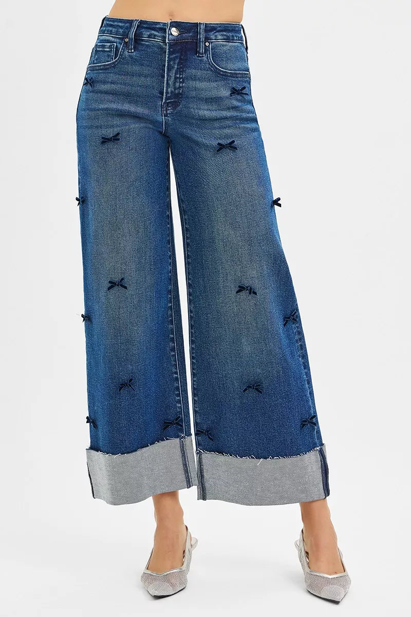 NEWYORKLISTED STYLE COLLECTION: Blue wide-leg jeans with decorative elements on a white background