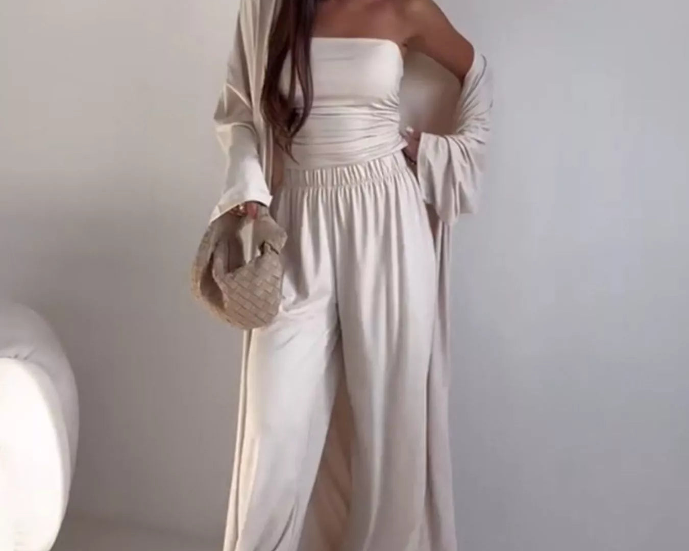 NEWYORKLISTED COMFORT COLLECTION: Woman wearing a white outfit with a plain background