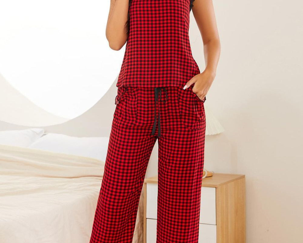 NEWYORKLISTED Intimate Apparel: Woman wearing red plaid pajamas in a bedroom setting