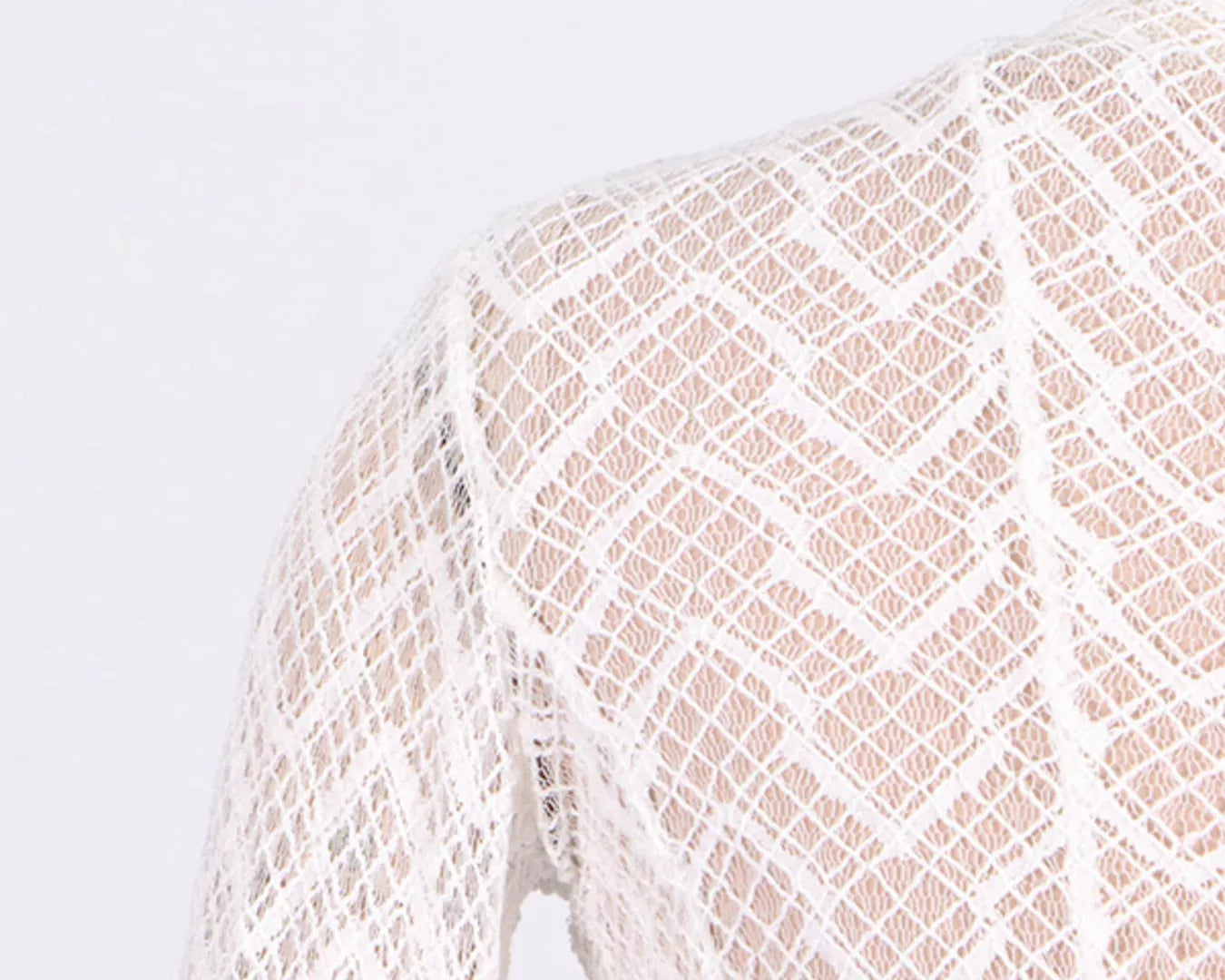 NEWYORKLISTED STYLE COLLECTION: Close-up of a textured fabric with a geometric pattern on a white background