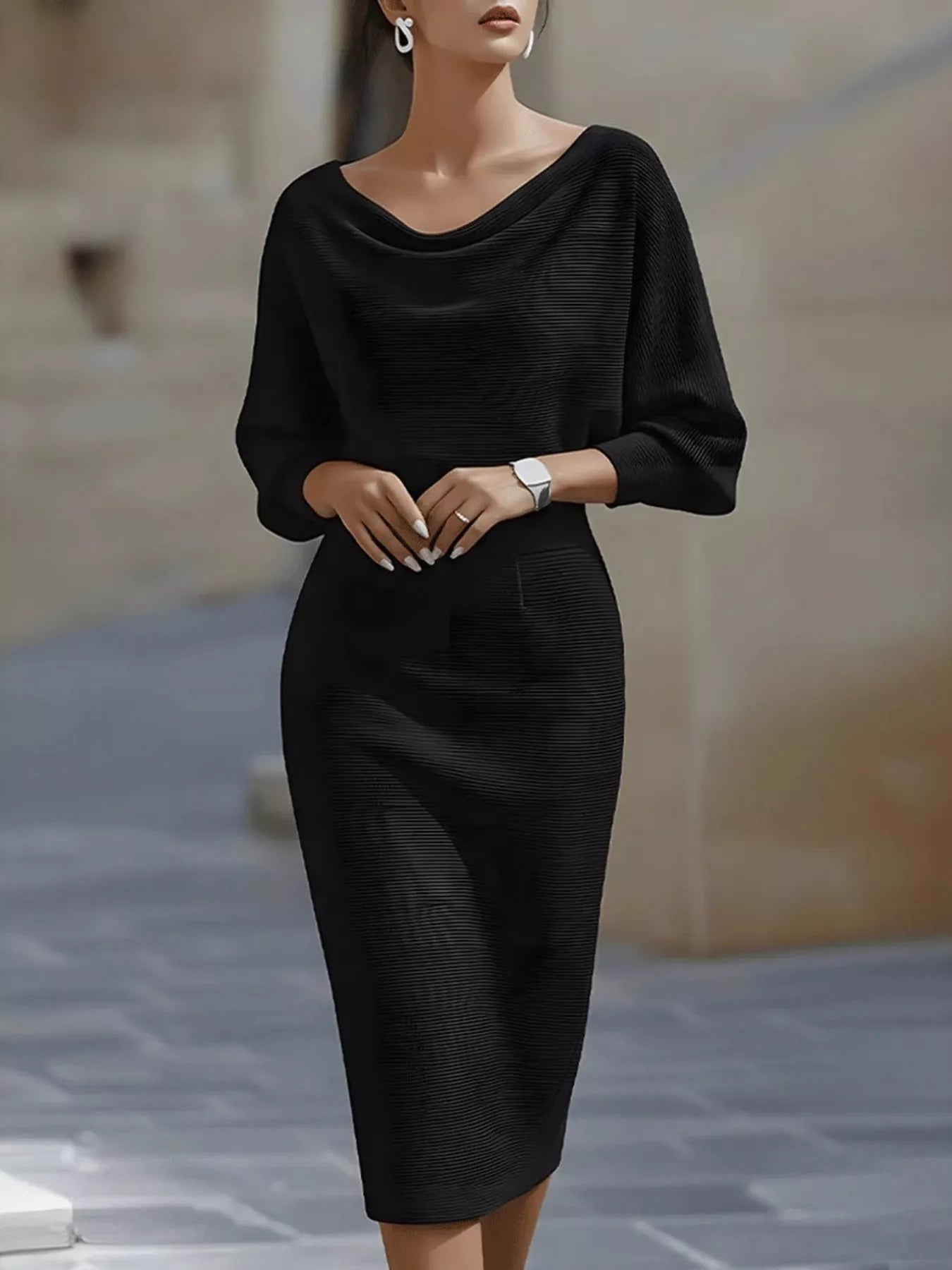 NEWYORKLISTED STYLE COLLECTION: Woman wearing a black dress standing on a street.