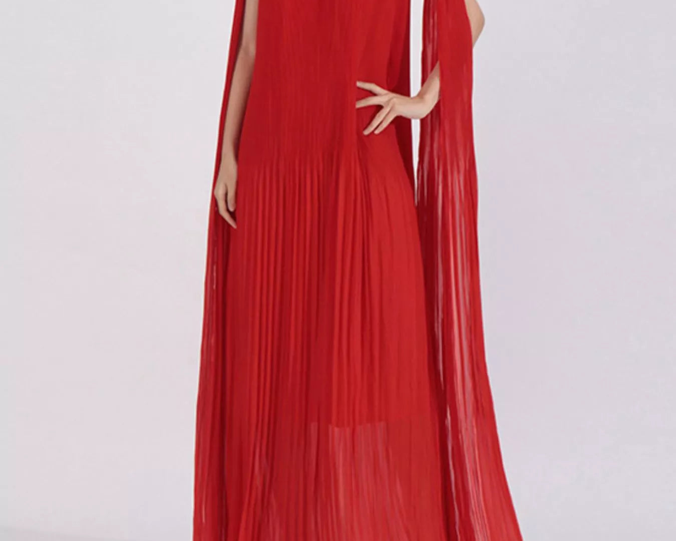 NEWYORKLISTED STYLE COLLECTION: Woman wearing a long, off-shoulder red dress with floral details