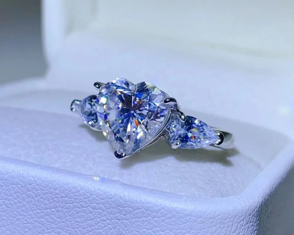 NYLD Glamour Collection By NEWYORKLISTED: Heart-shaped diamond ring on a white cushion