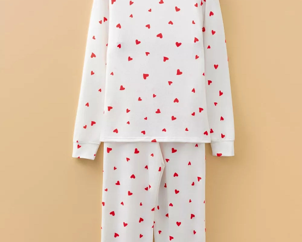 NEWYORKLISTED Intimate Apparel Collection: pajama set with red heart patterns on a beige background