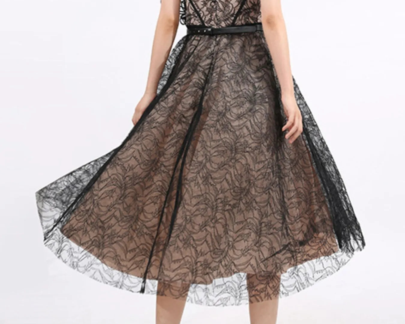 NEWYORKLISTED RUNWAY STYLE: Black lace dress on a white background