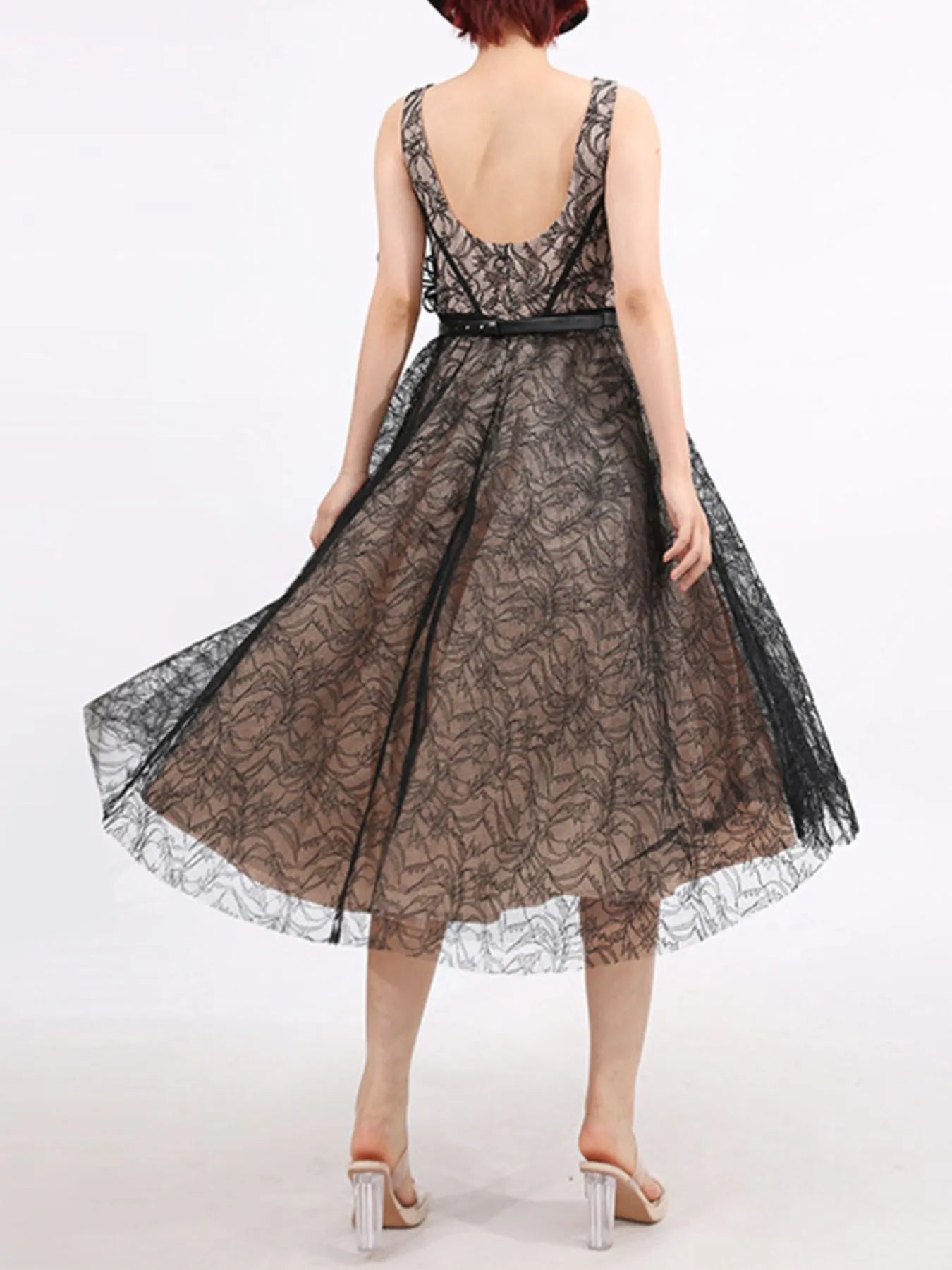 NEWYORKLISTED RUNWAY STYLE: Black lace dress on a white background