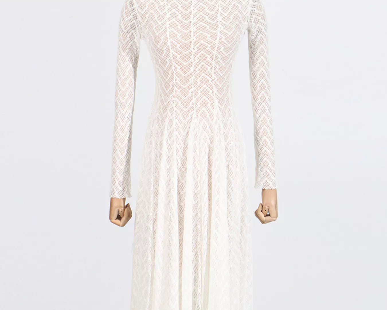 NEWYORKLISTED STYLE COLLECTION: White lace dress on a mannequin against a white background