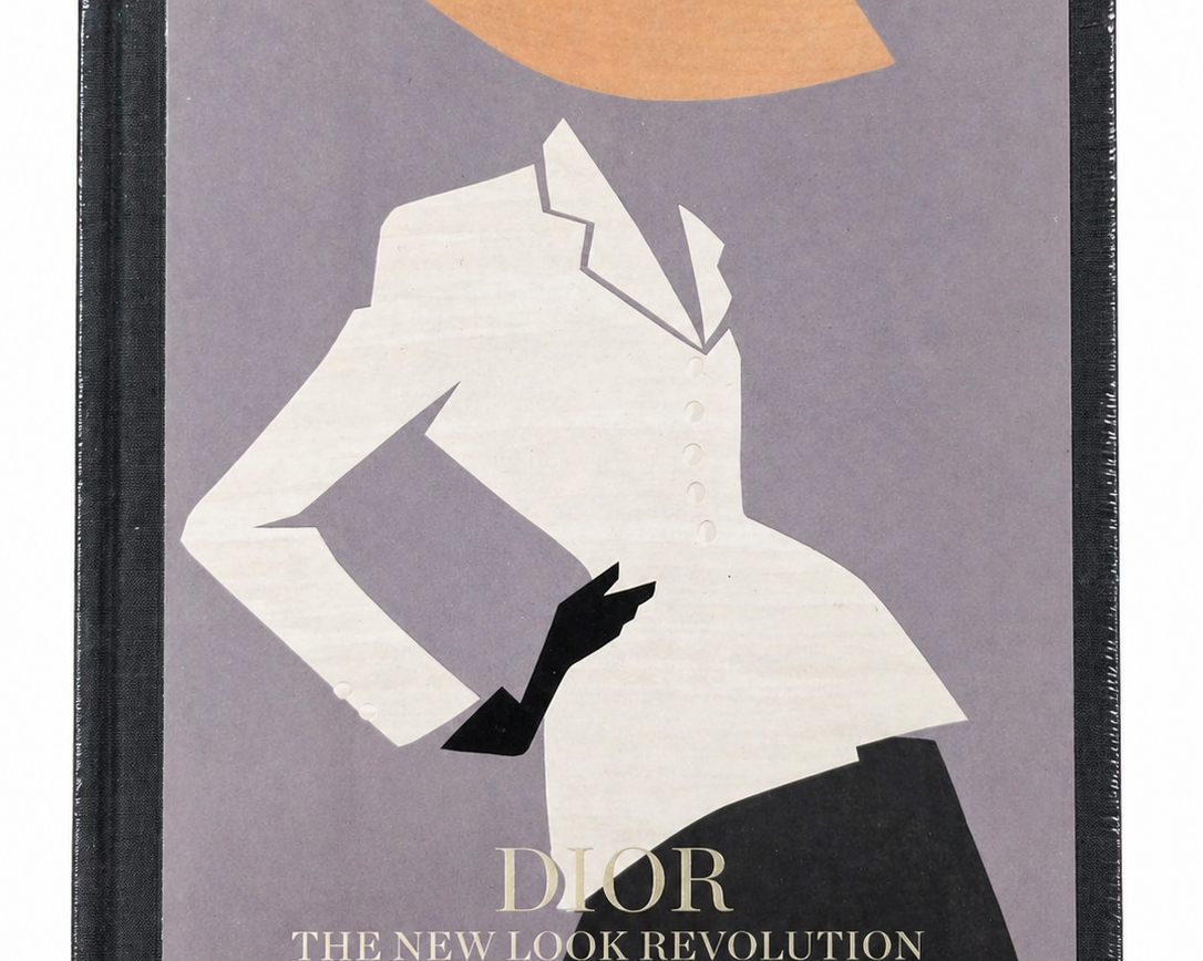 Book cover of 'Dior: The New Look Revolution' by Rizzoli with a silhouette design.