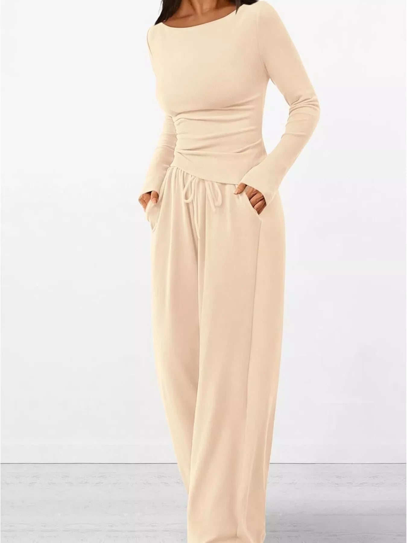 Beige long-sleeve dress on a white background