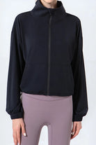 NEWYORKLISTED ACTIVEWEAR COLLECTION: Black jacket and gray leggings on a white background