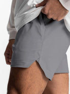 NEWYORKLISTED ATLAS MEN'S COLLECTION: Gray athletic shorts worn by a person on a white background