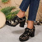 NEWYORKLISTED STYLE COLLECTION: Black floral embroidered shoes worn with blue jeans against a natural stone and plant background