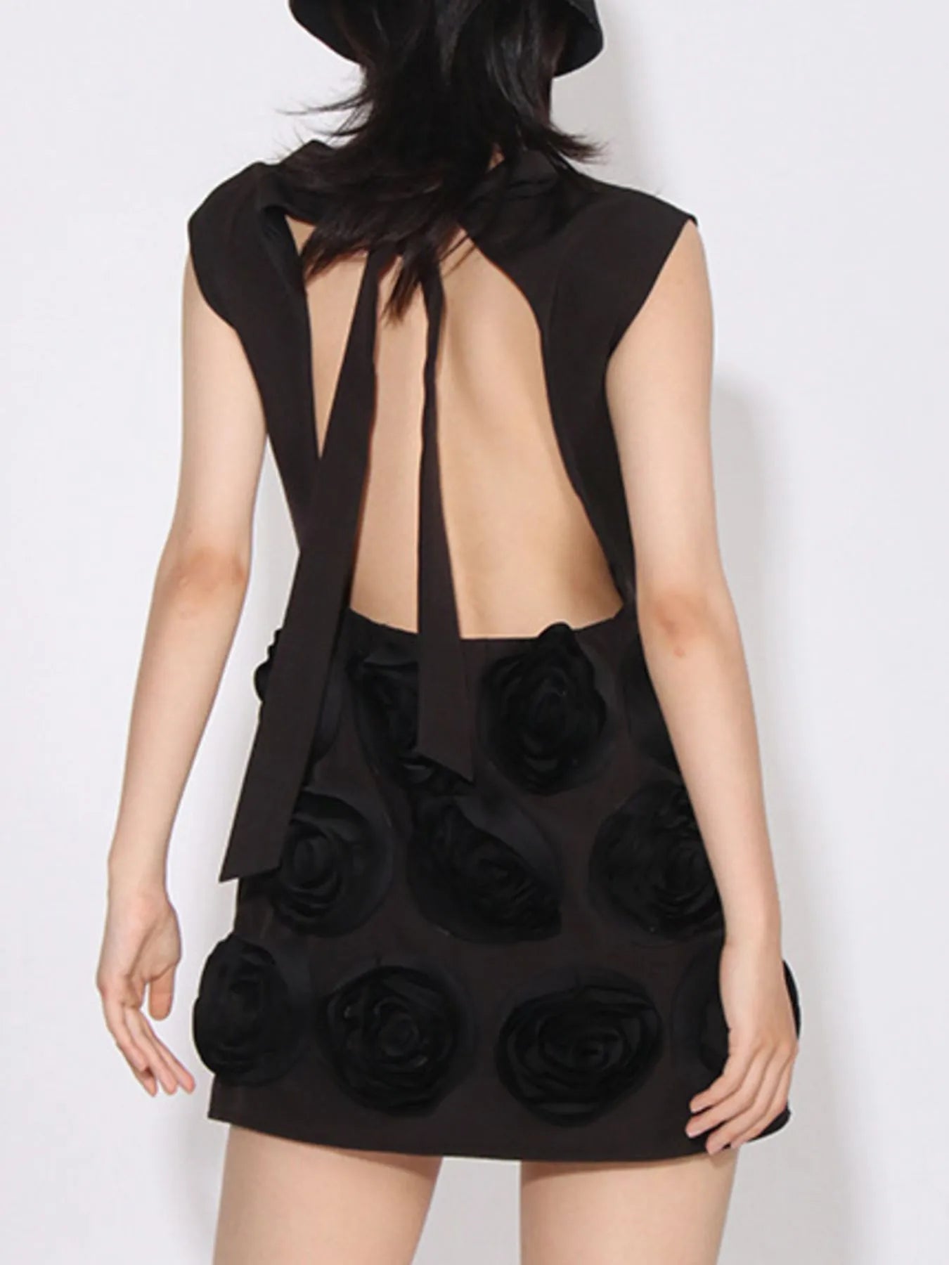 Black dress with floral details on a plain background, backless striped sleeveless mini dress with tie detail – NEWYORKLISTED Runway Style