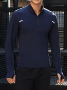 NEWYORKLISTED ATLAS MEN'S COLLECTION: Person wearing a navy long-sleeve athletic shirt with white accents against a dark background
