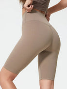 NEWYORKLISTED ACTIVEWEAR COLLECTION: Beige high-waisted leggings worn by a person on a plain background