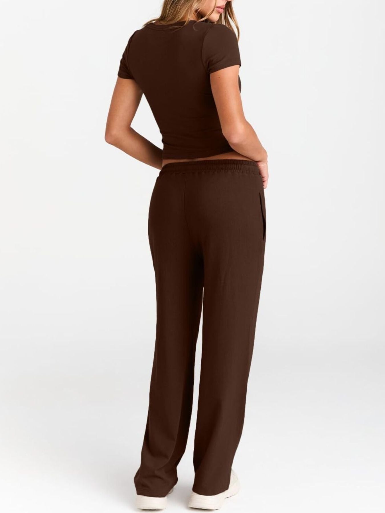 NEWYORKLISTED COMFORT COLLECTION: Person wearing a brown outfit on a white background