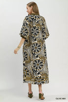 NEWYORKLISTED STYLE COLLECTION: Woman wearing a patterned dress on a white background